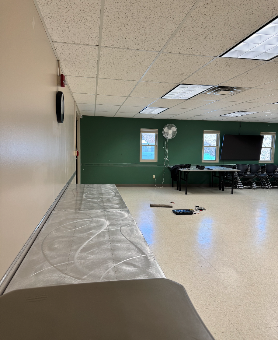 May contain: floor, flooring, desk, furniture, table, indoors, and interior design
