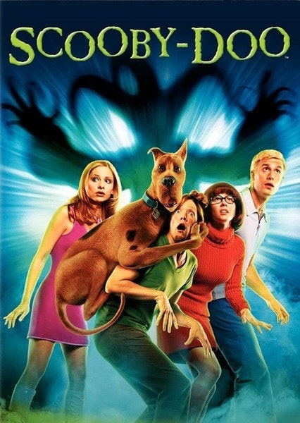 Four people and a dog look surprised with a shadowy figure in the background. "Scooby-Doo" is written above them.