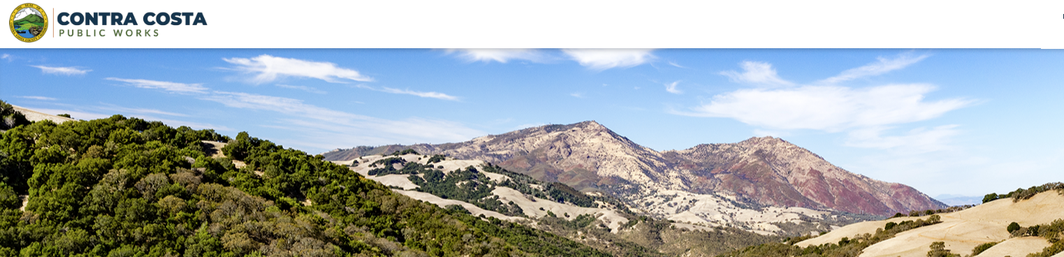 Mountain landscape under a blue sky with "Contra Costa Public Works" logo in the top left corner.