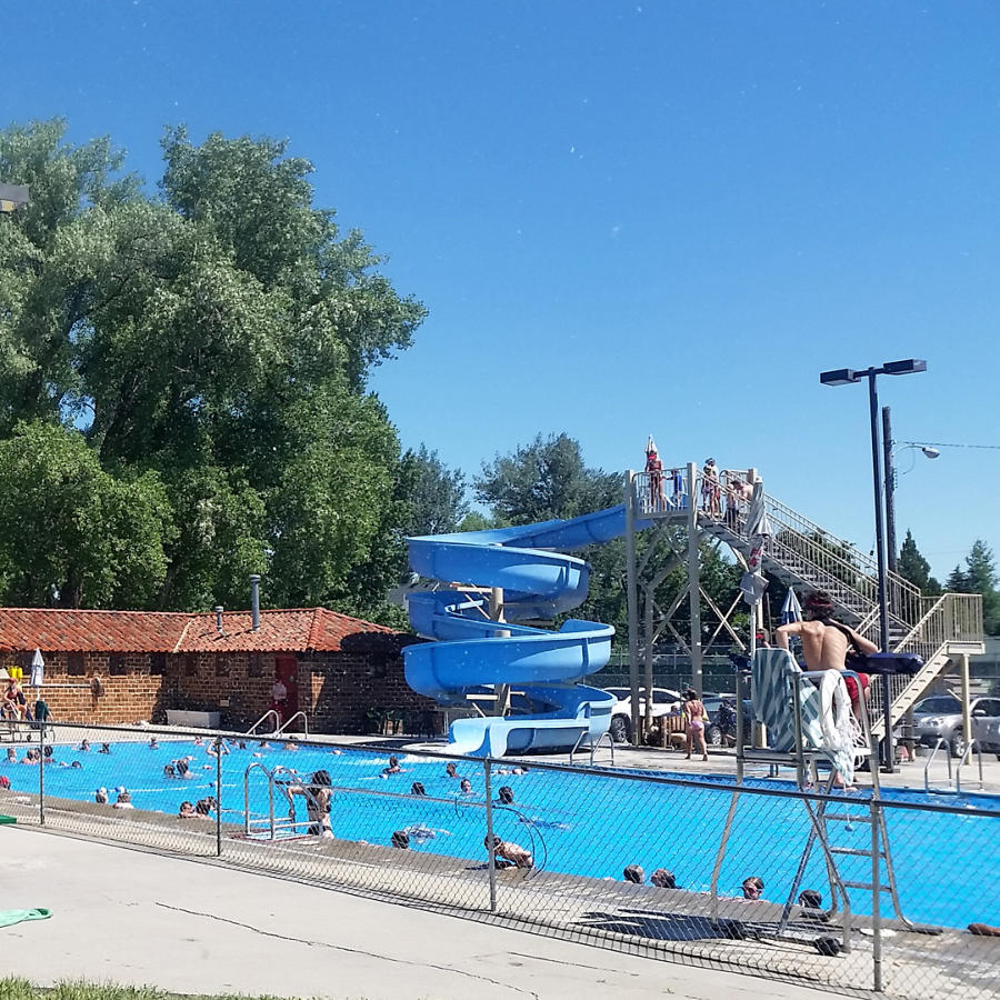 Photo of a swimming pool and people swimming