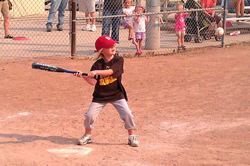 Photo of a child playing baseball