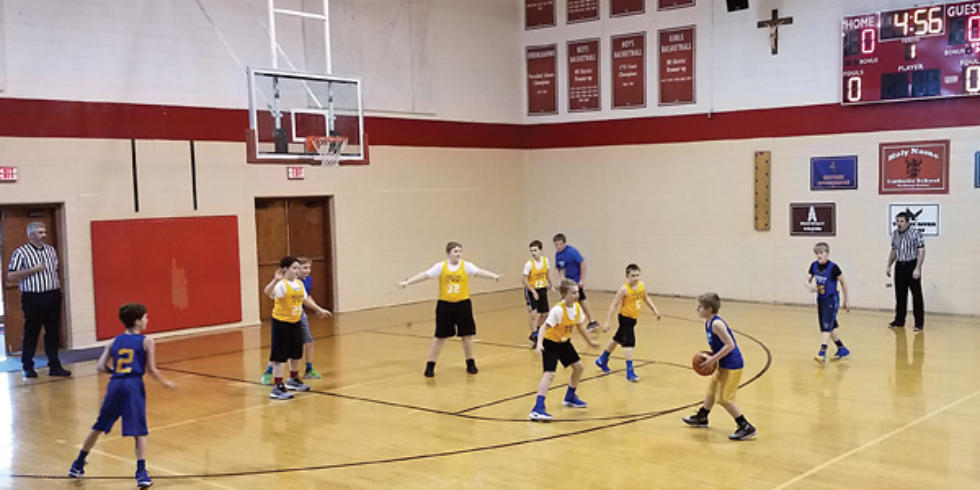 Photo of kids playing basketball
