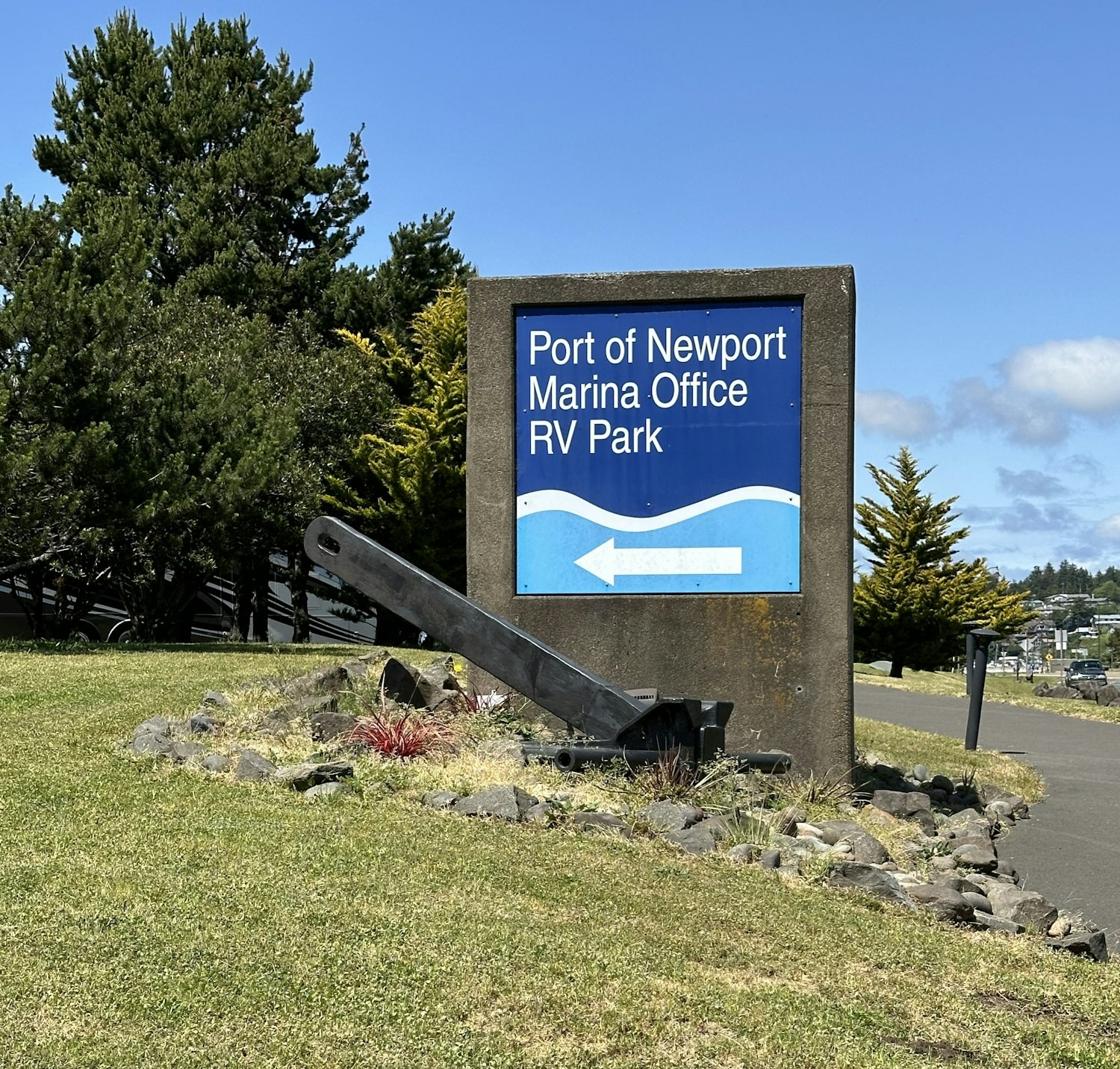 Sign for Port of Newport Marina Office and RV Park with a directional arrow and an anchor display.