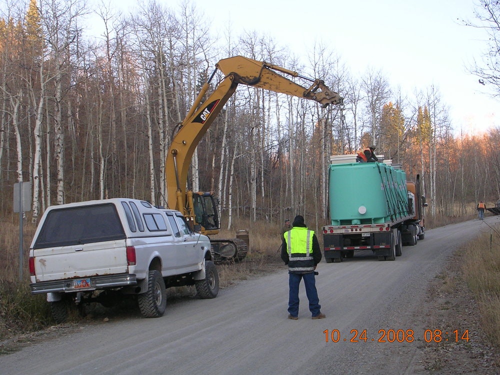 May contain: transportation, truck, vehicle, clothing, hardhat, helmet, person, license plate, car, machine, and wheel