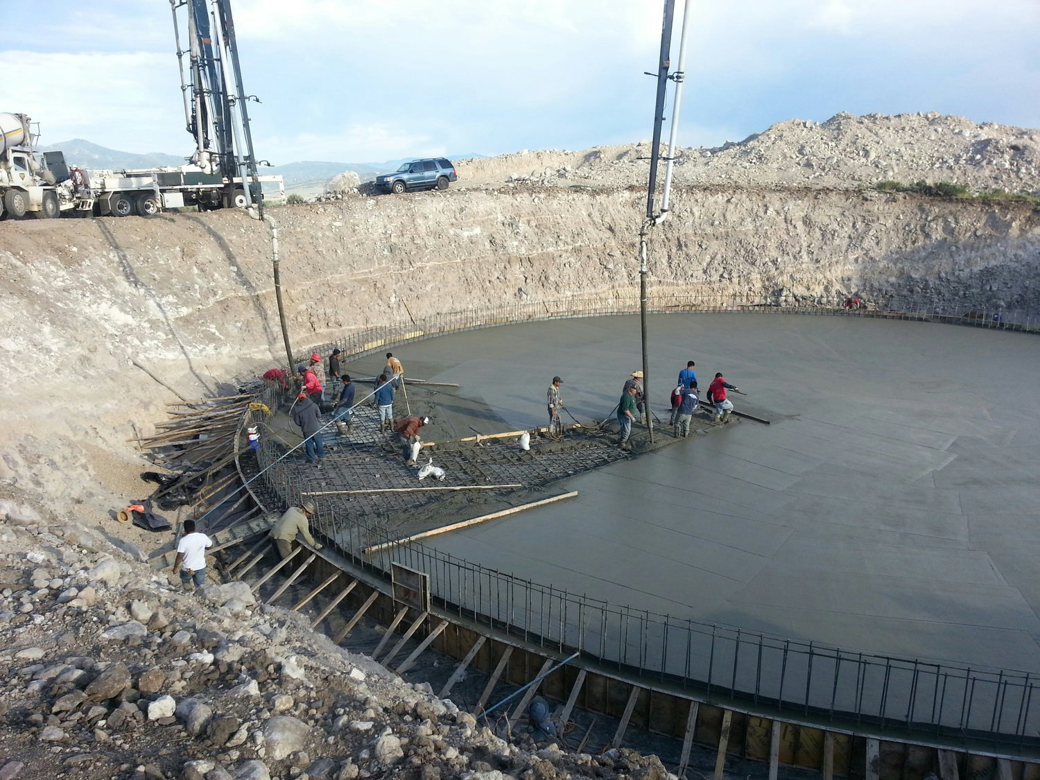 May contain: outdoors, water, person, helmet, and construction