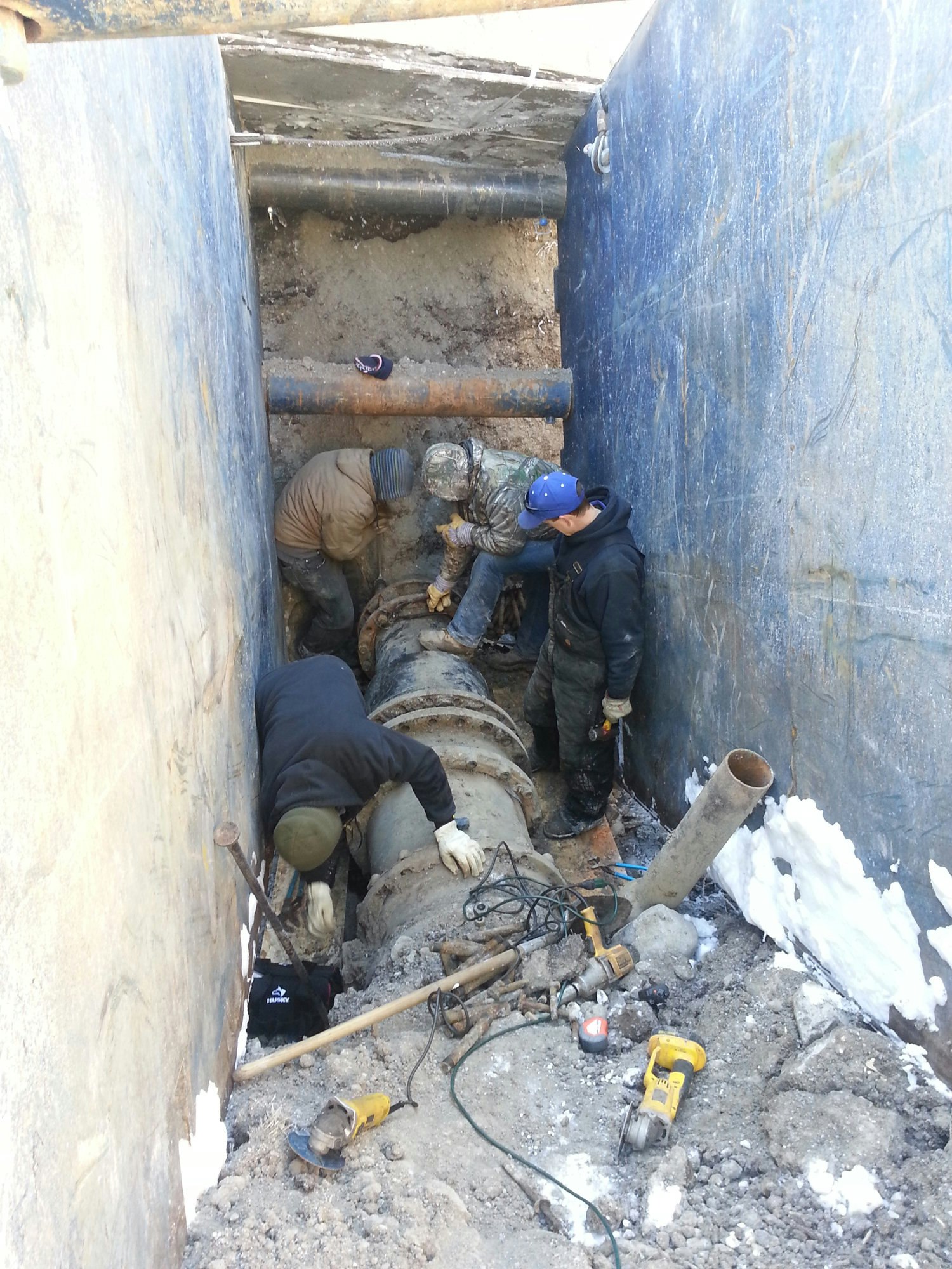 May contain: clothing, glove, slate, architecture, building, outdoors, shelter, person, and helmet