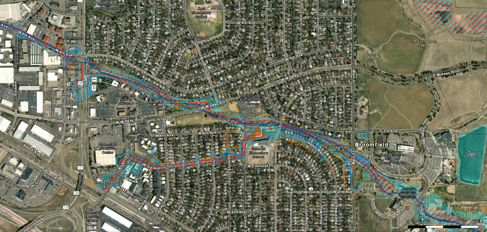 Aerial map with flood overlay, showing water flow, risk areas, and infrastructure in a populated region.