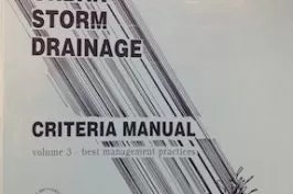 A partial view of a manual cover titled "STORM DRAINAGE CRITERIA MANUAL, volume 3 - best management practices."