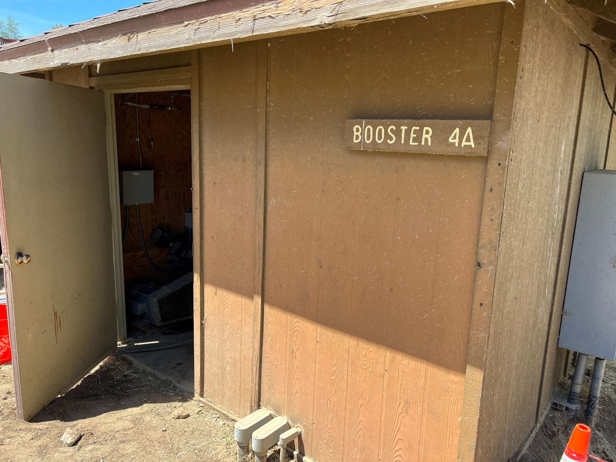 A small structure marked "Booster 4A" with an open door, revealing some equipment inside.