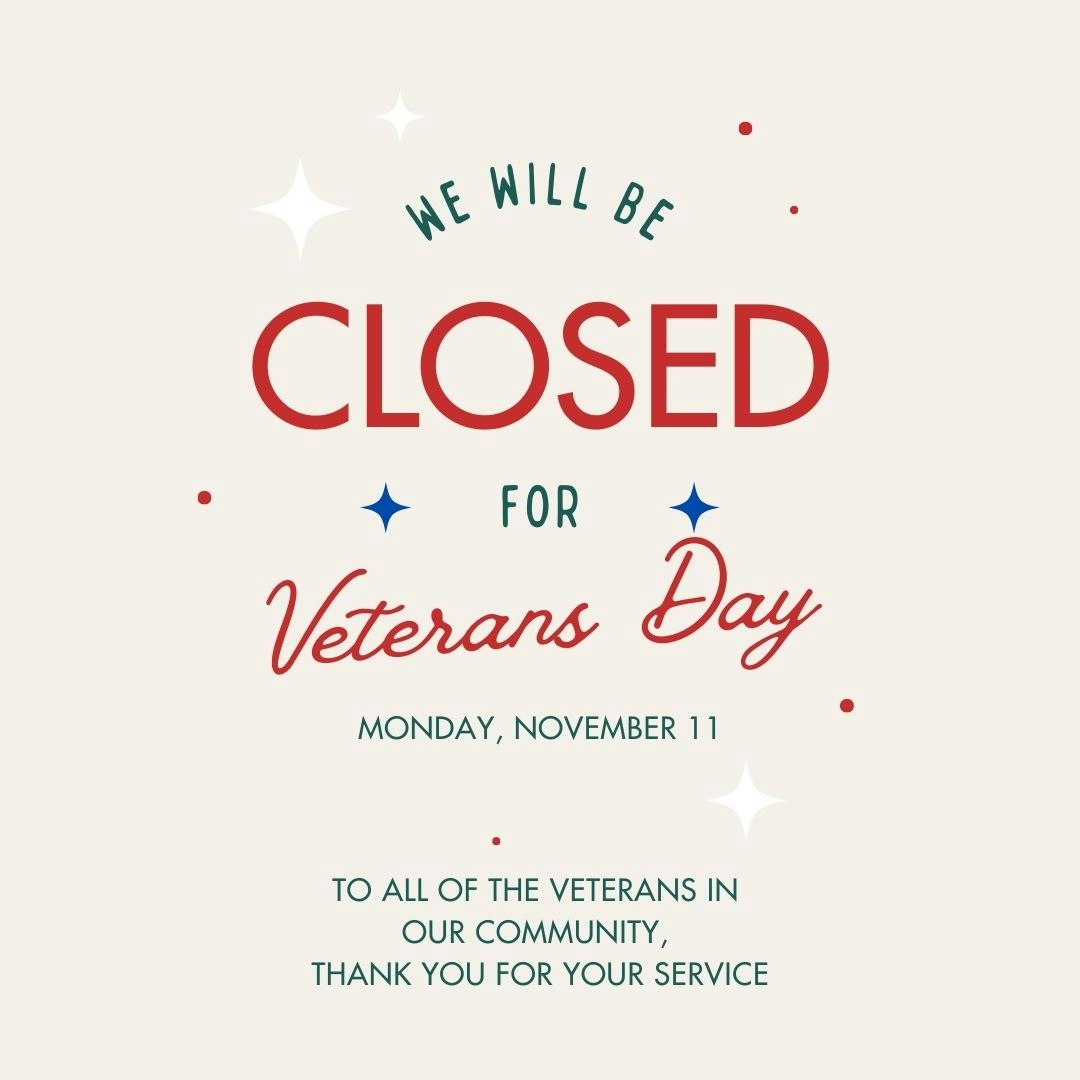 A sign stating closure for Veterans Day on November 11 with a thank you message to veterans.