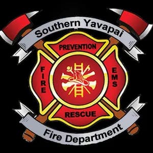 A Southern Yavapai Fire Department emblem with fire service symbols.