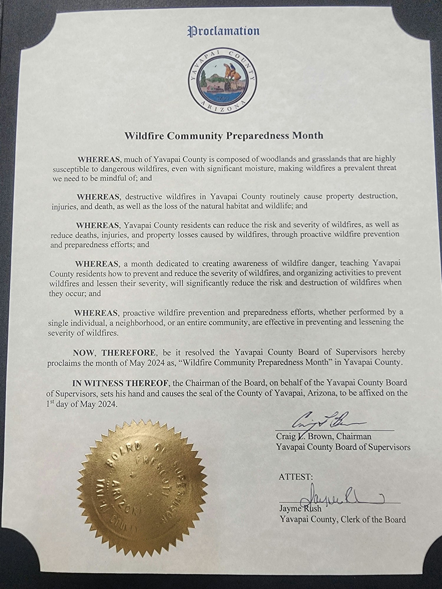 A proclamation document with a seal and signatures, rotated 90 degrees counterclockwise.