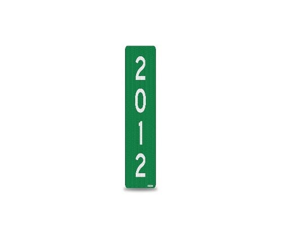 The image depicts a tall green sign with the numbers "2012" prominently displayed on it.