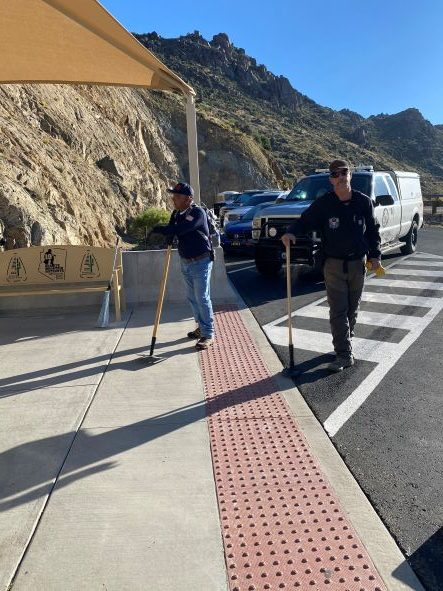 May contain: path, sidewalk, adult, male, man, person, clothing, and hat
