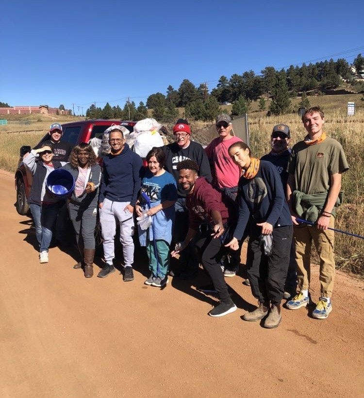 May contain: people, person, boy, male, teen, adult, female, woman, groupshot, man, nature, outdoors, clothing, footwear, shoe, baton, and stick