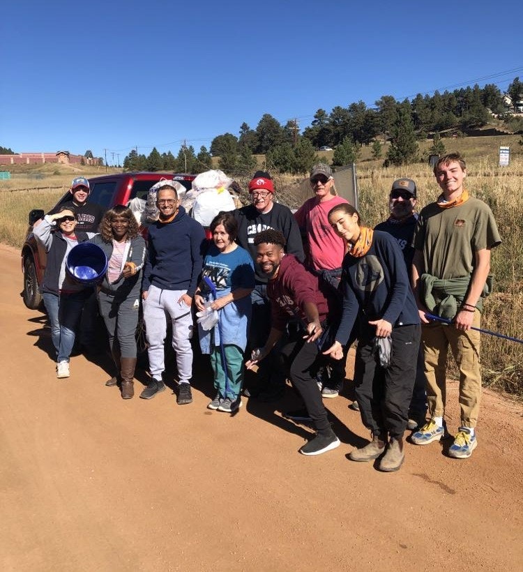 May contain: people, person, boy, male, teen, adult, female, woman, groupshot, man, nature, outdoors, clothing, footwear, shoe, baton, and stick