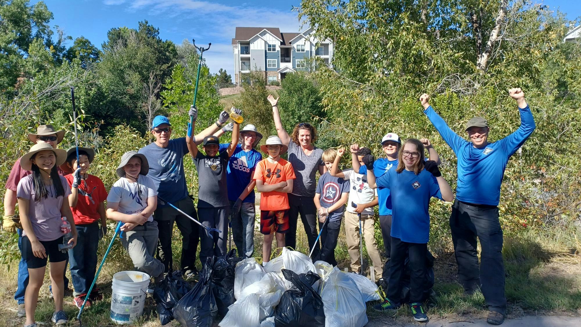 Image of a Creek Week cleanup crew with bags of trash