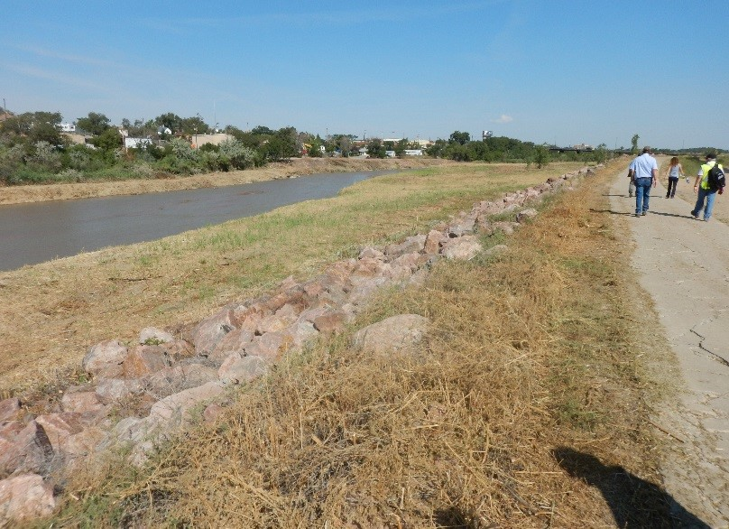 May contain: path, walking, person, grass, plant, trail, outdoors, nature, rock, soil, vegetation, land, wilderness, water, scenery, and canal
