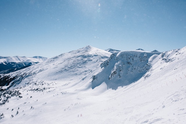 A snowy mountain landscape under a clear blue sky Colorado