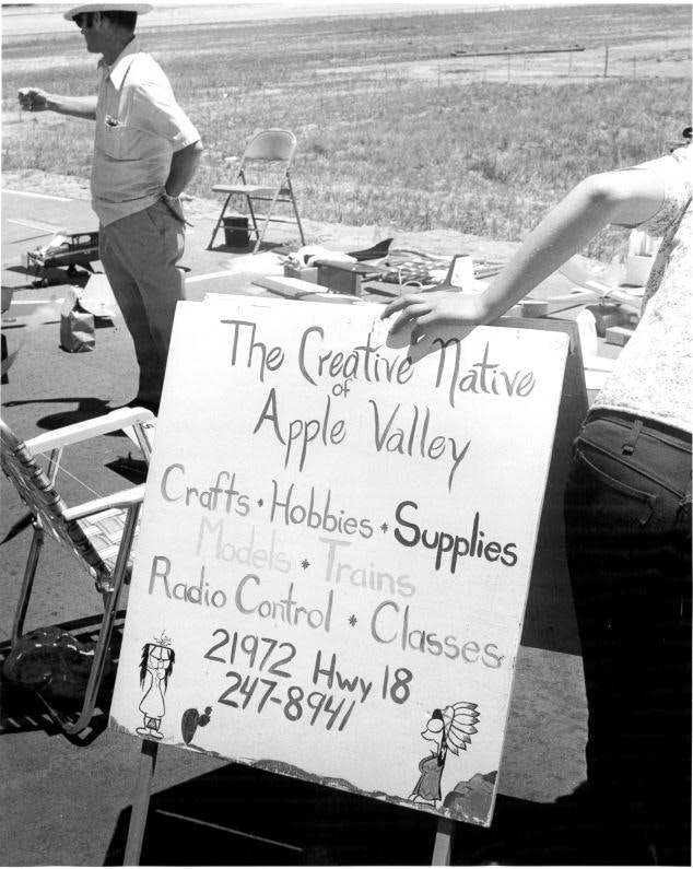 Sign for "The Creative Native of Apple Valley" offering crafts, hobbies, and supplies. Includes contact info and illustrations.