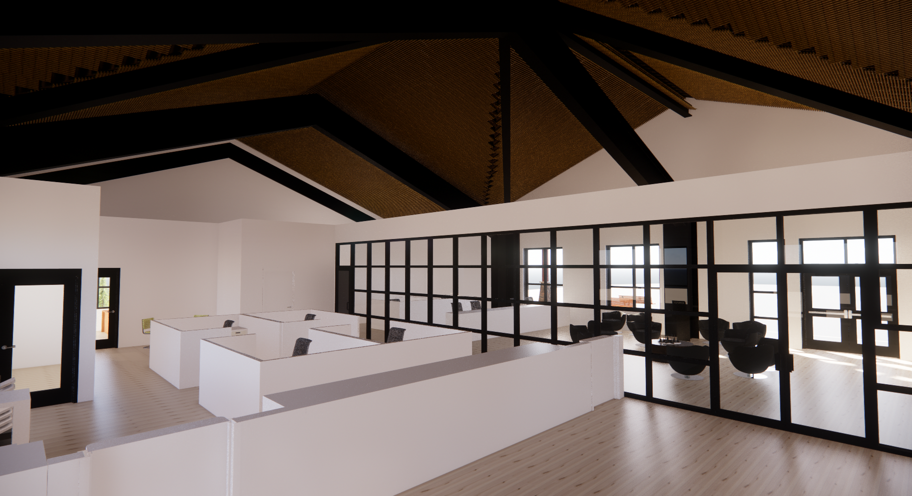 Modern office space with white cubicles, black-framed glass partitions, and a meeting area with black chairs.