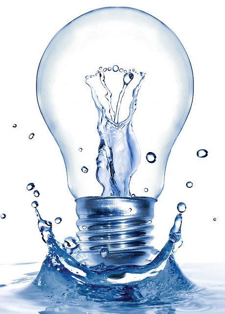 Light bulb with water splash resembling it being turned on.
