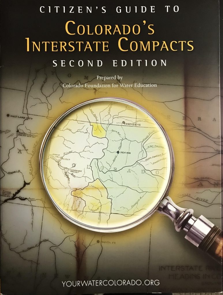 A book titled "Citizen's Guide to Colorado's Interstate Compacts" with a magnifying glass on a map.