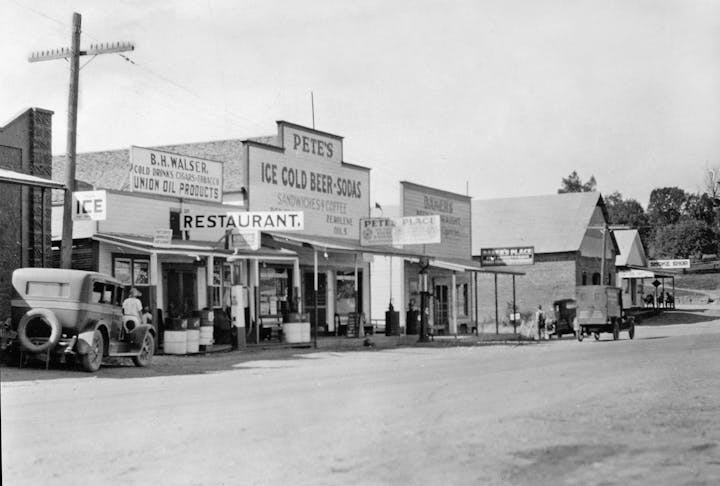 May contain: machine, wheel, person, human, gas station, and pump