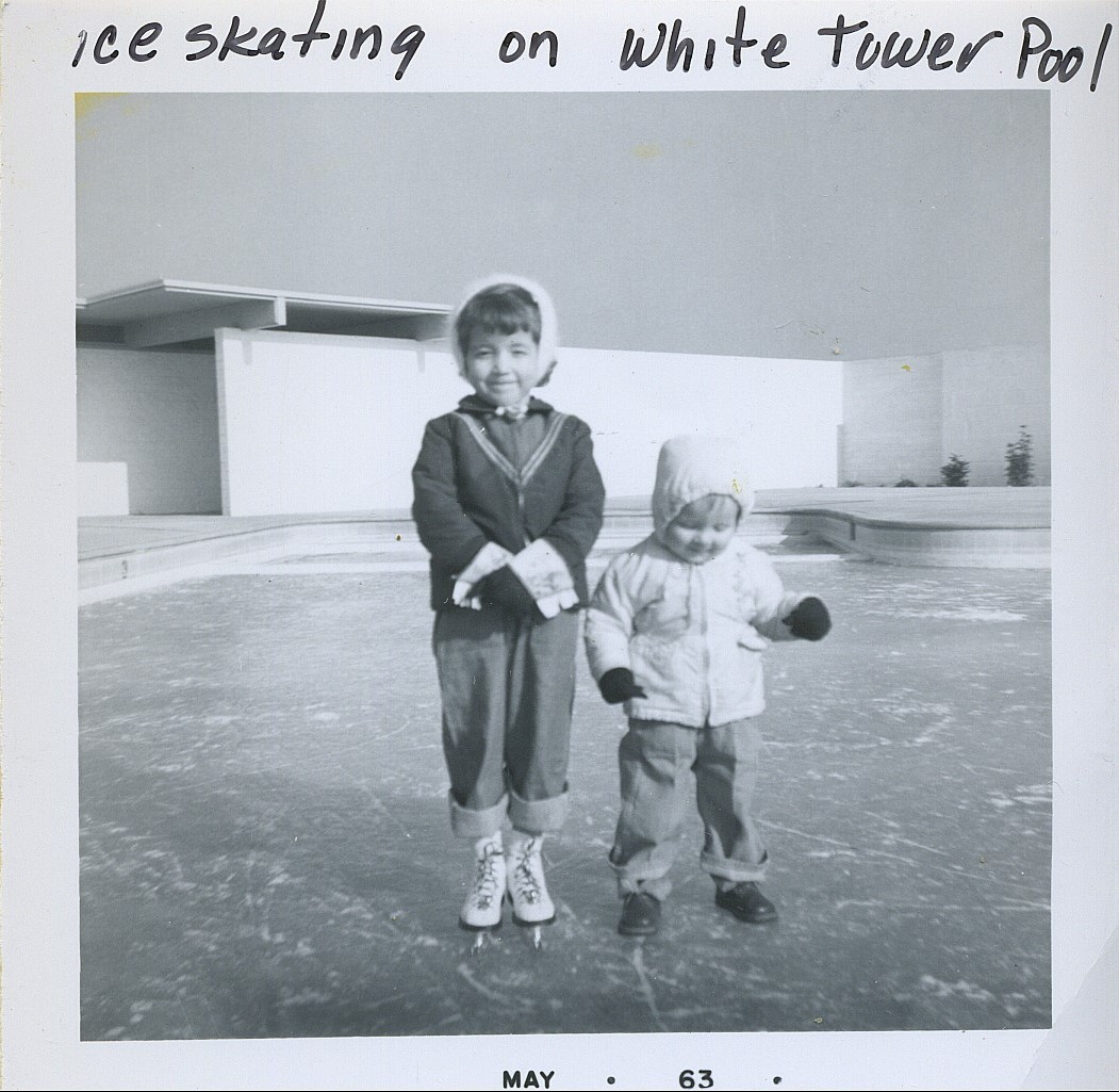Two children ice skating on a frozen surface, labeled "ice skating on White Tower Pool," dated May '63.