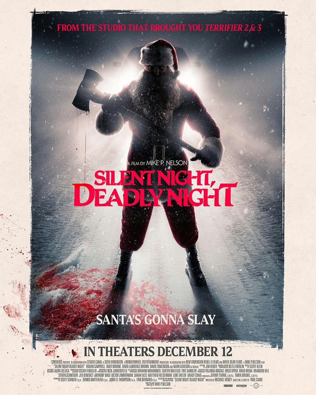 A horror movie poster for "Silent Night, Deadly Night," featuring a sinister Santa with an axe, coming to theaters December 12.