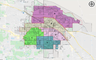 A map divided into five color-coded regions labeled A to E, with roads and geographical details, and a compass in the corner.