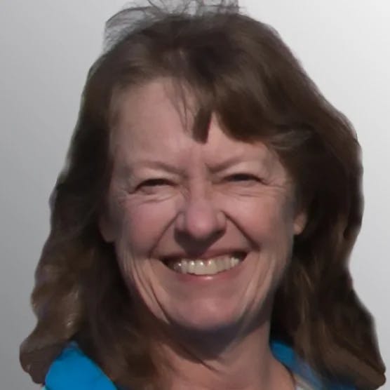 smiling woman with long brown hair