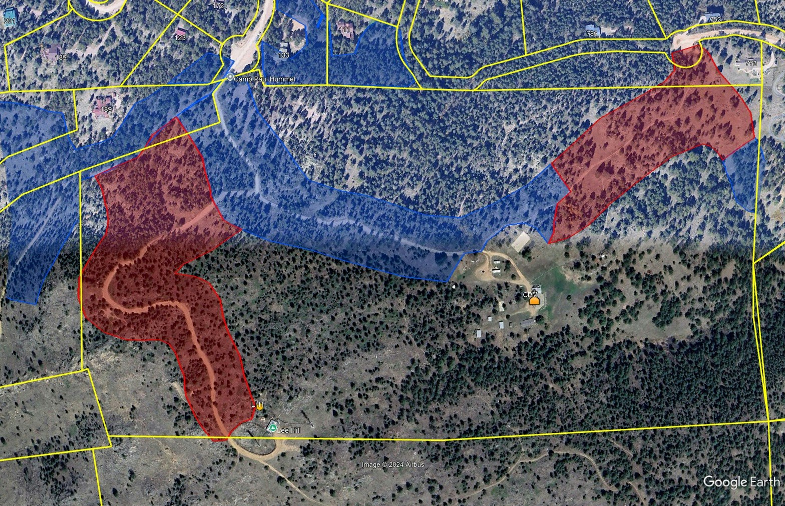 Map with highlighted areas in red and blue, showing boundaries and paths, labeled "Camp Paul Hummel" and "Lee Hill."