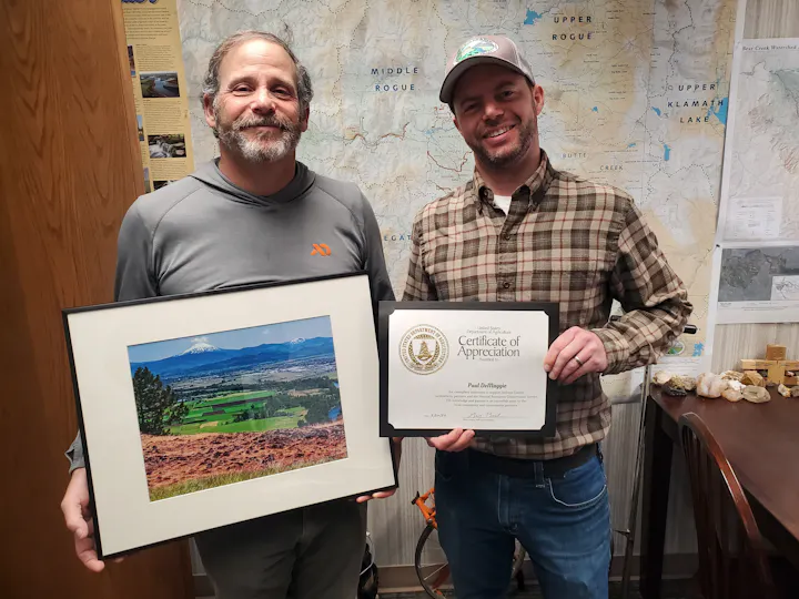 Peter Winnick and Paul DeMaggio with Paul's Certificate of Appreciation from the NRCS.