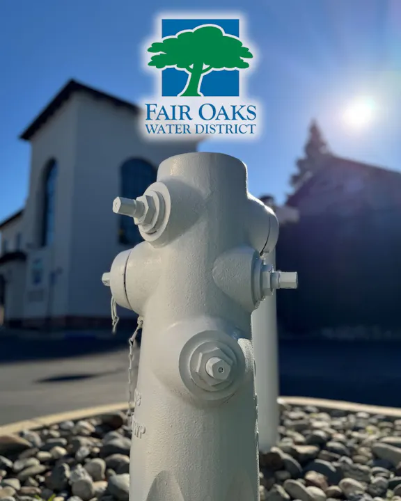 The image features a white fire hydrant with a backdrop of a building, along with the Fair Oaks Water District logo.