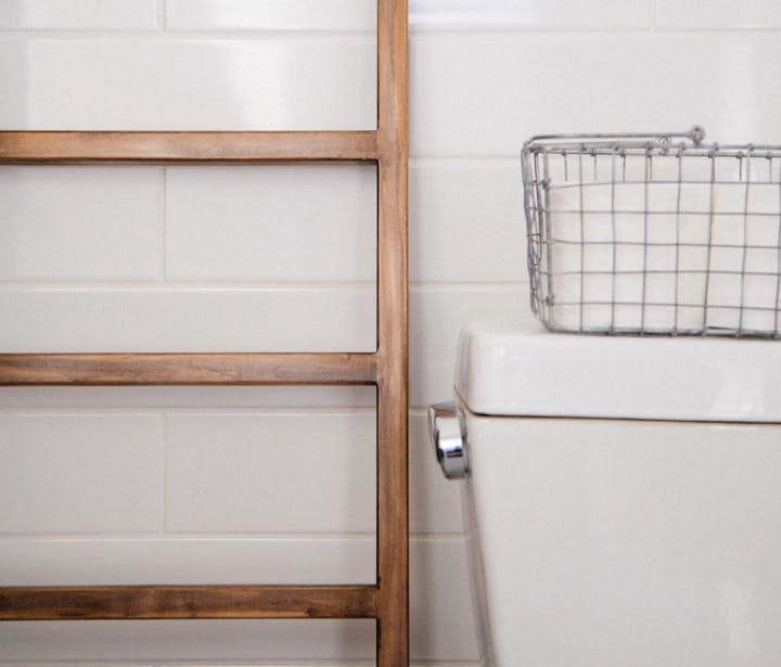 back of a toilet with a shelf