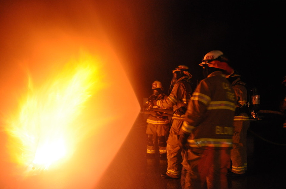 May contain: person, human, fireman, bonfire, fire, and flame