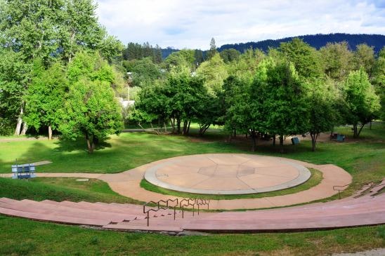 May contain: grass, lawn, park, outdoors, trees, and ampitheater