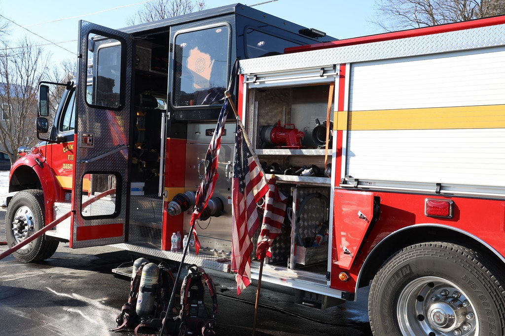 Engine 411 with three recovered American flags.