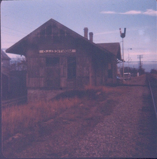 May contain: architecture, building, countryside, hut, nature, outdoors, rural, terminal, railway, train, train station, transportation, and vehicle