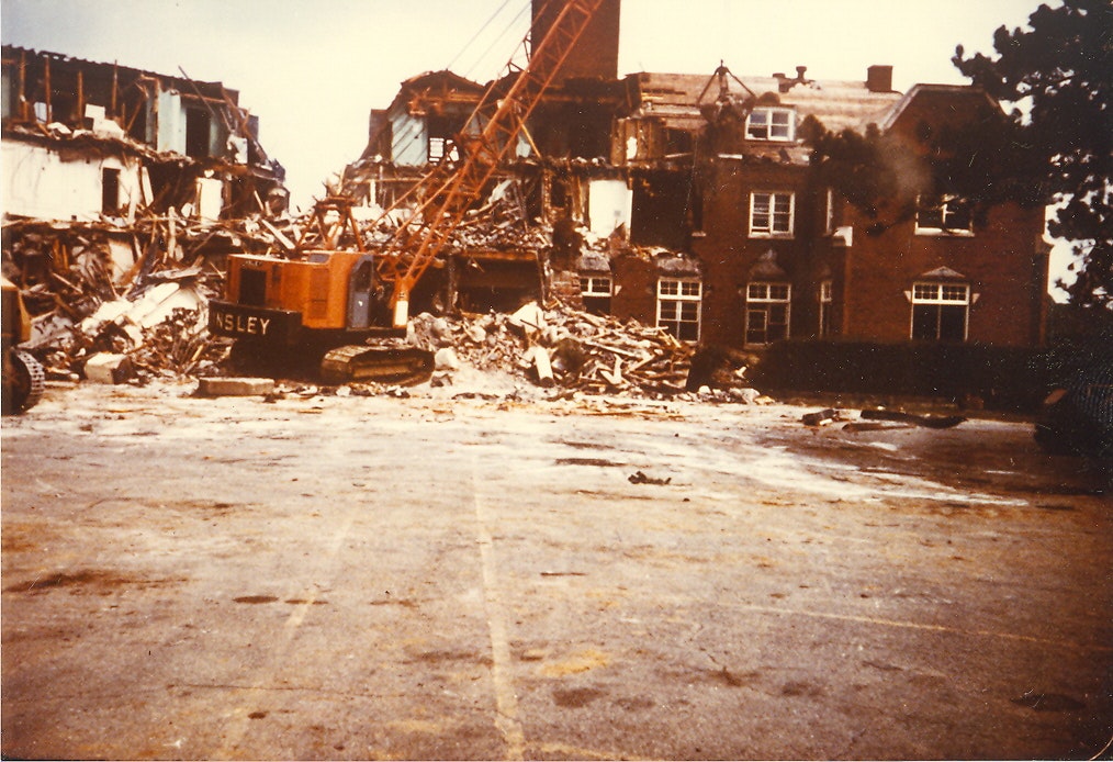 May contain: demolition, architecture, building, city, machine, and wheel