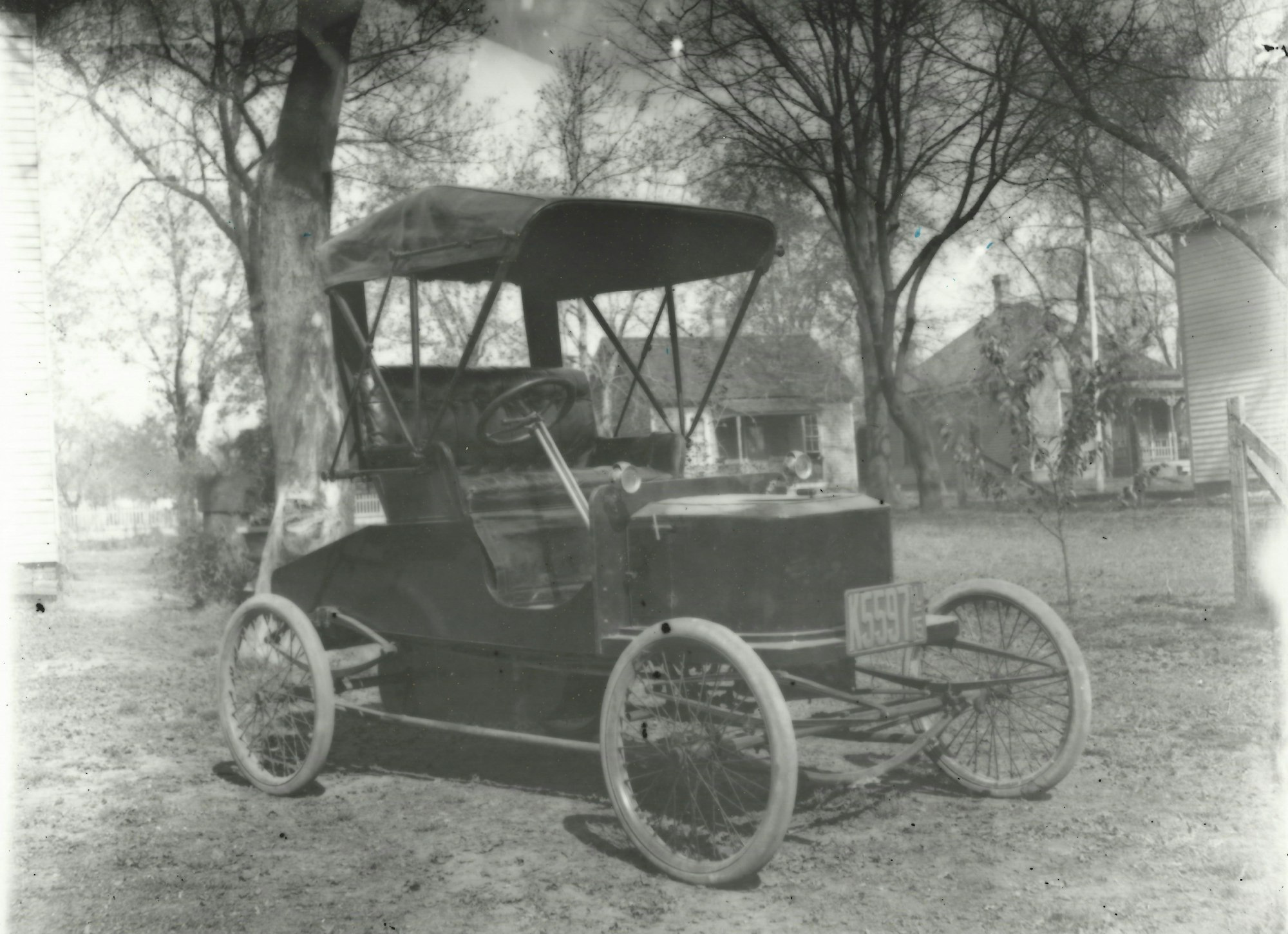 May contain: antique car, car, model t, transportation, vehicle, machine, wheel, and spoke