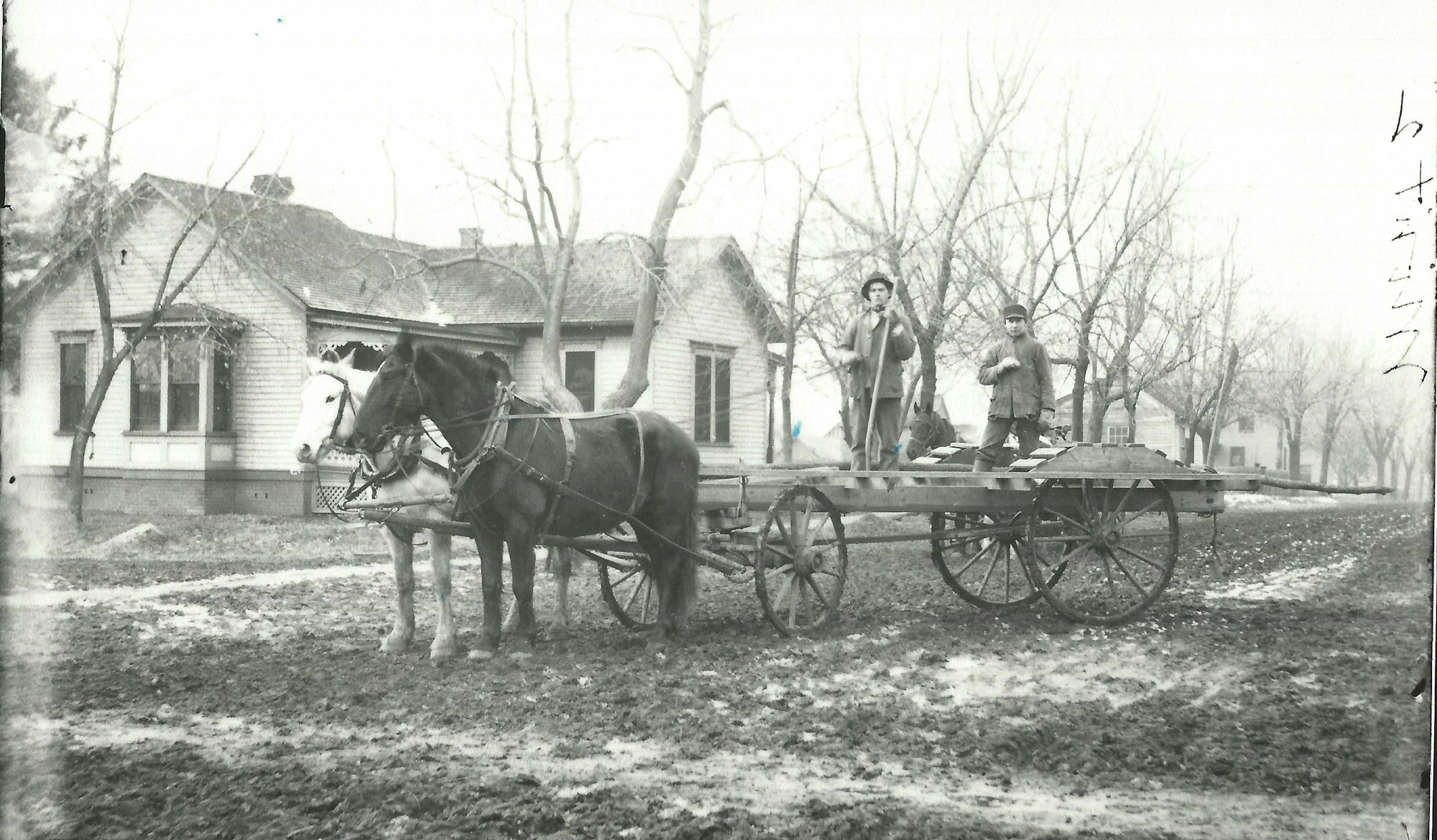 May contain: transportation, vehicle, wagon, person, horse cart, clothing, hat, animal, horse, mammal, machine, and wheel