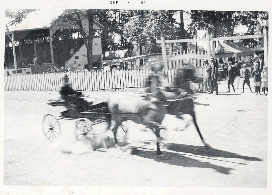 May contain: person, machine, wheel, carriage, transportation, vehicle, and wagon