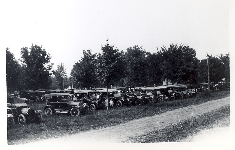May contain: antique car, car, model t, transportation, vehicle, machine, wheel, and person