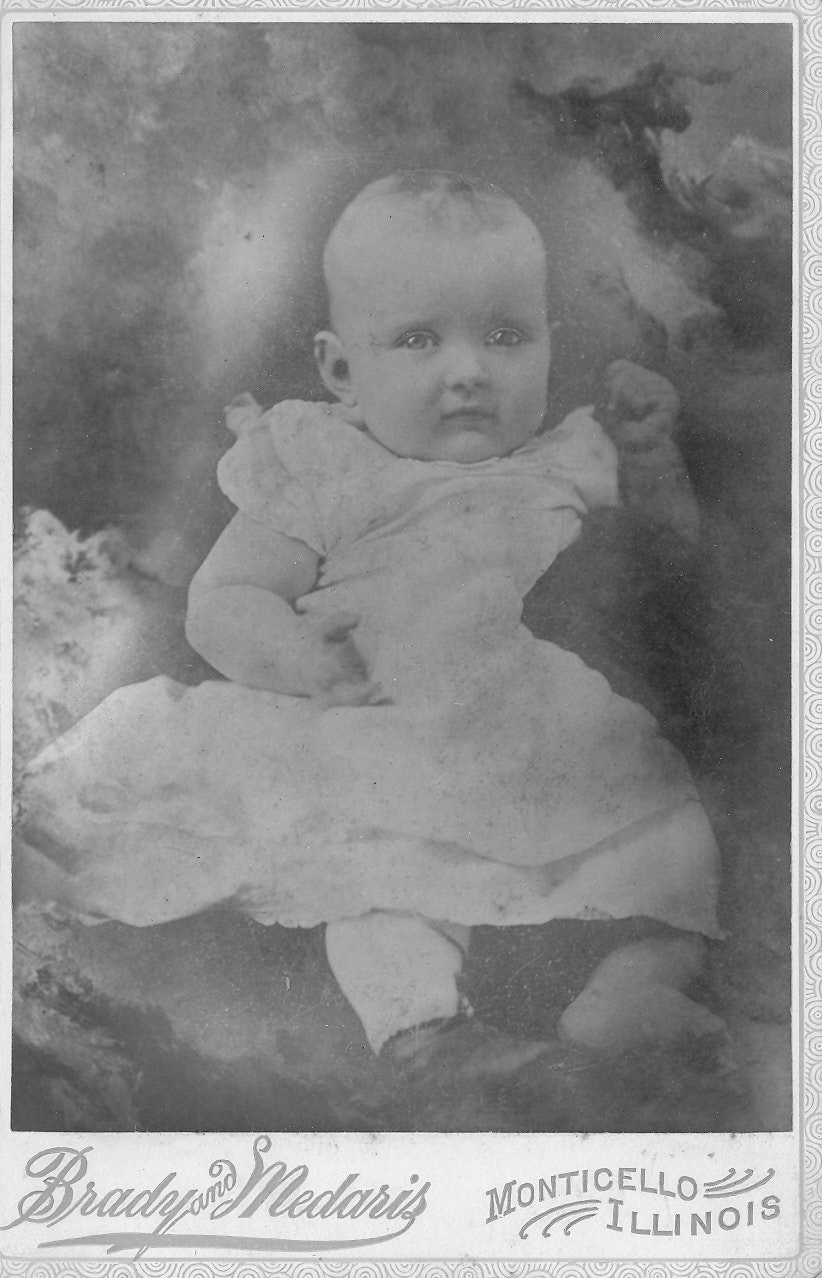 May contain: face, head, person, photography, portrait, and baby