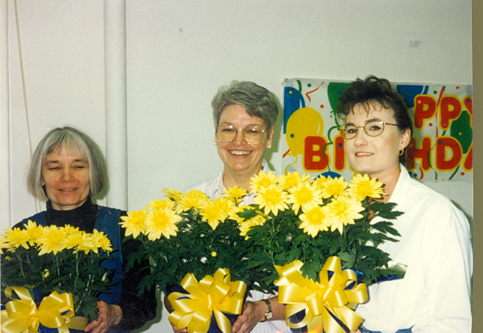 May contain: flower, flower arrangement, plant, flower bouquet, daisy, person, people, face, and head
