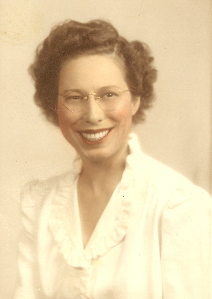 May contain: face, head, person, photography, portrait, happy, smile, blouse, clothing, lady, accessories, and glasses