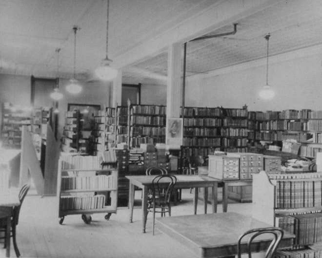 May contain: book, publication, indoors, library, chair, furniture, desk, table, and shop