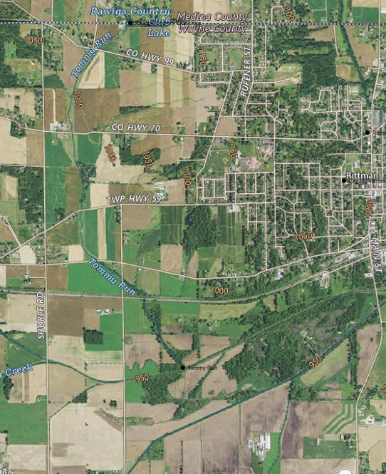 Aerial map of Rittman, showing roads, fields, and water bodies like Tommy Run, Rawiga Lake, and various highways.